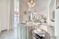 Posezení v ubytování Suave 2BR with Assistant Room at Mesk 1 Midtown Dubai Production City by Deluxe Holiday Homes
