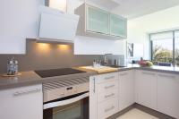 Kuchyň nebo kuchyňský kout v ubytování Home2Book Cozy Apt Santa Úrsula, Sea Views & Pool