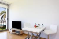 TV a/nebo společenská místnost v ubytování Home2Book Cozy Apt Santa Úrsula, Sea Views & Pool