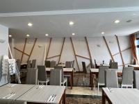 a dining room with wooden tables and chairs at Perla Marina in Nerja