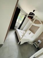a white bunk bed in a room with a window at Nid’Ange in Piolenc