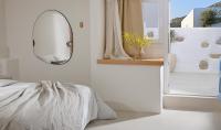 A bed or beds in a room at VLIA Mykonos