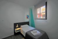 Cama o camas de una habitación en CASATURIS NEWON APARTAMENTOS en EL CAMPELLO