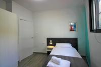 Cama o camas de una habitación en CASATURIS NEWON APARTAMENTOS en EL CAMPELLO