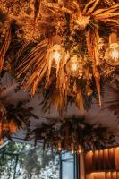 a chandelier with lights hanging from a ceiling at Boutique Hotel OLOM - Only Adults recommended in Cádiz