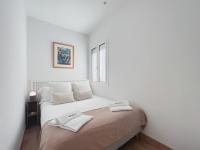 A bed or beds in a room at Stay U-nique Apartments Urquinaona II