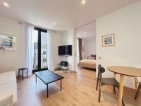 A television and/or entertainment centre at Stay U-nique Apartments Urquinaona II