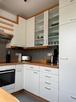 Kuchyň nebo kuchyňský kout v ubytování FeWo-Julius am Weser-Sandstrand