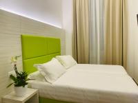 A bed or beds in a room at Hotel Fioralba