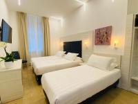 A bed or beds in a room at Hotel Fioralba
