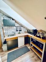 Kuchyň nebo kuchyňský kout v ubytování Apartmány v ráji (Českém)