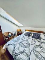 Postel nebo postele na pokoji v ubytování Apartmány v ráji (Českém)