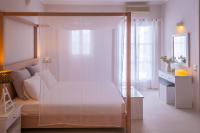 Posteľ alebo postele v izbe v ubytovaní Milos Bay Suites
