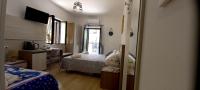 Posteľ alebo postele v izbe v ubytovaní Bellavista Rooms