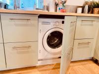 a white washer and dryer in a kitchen at Le Pandora, Charmant Studio - Hypercentre in Rennes