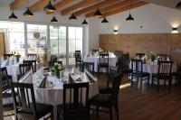 a dining room with white tables and chairs at Hotel Gaststätte Weinbrücke in Kulmbach
