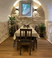 a dining room with a table with chairs and a window at Hotel Gaststätte Weinbrücke in Kulmbach