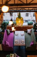 a patio with a table and chairs and a pumpkin at Paris Hotel Yerevan in Yerevan