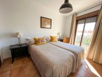 Posteľ alebo postele v izbe v ubytovaní Apartamentos Villa Torcal