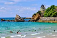 a group of people in the water at a beach at Appart Hypercentre Biarritz - PKG &#47; WIFI &#47; 4-6 Personnes in Biarritz
