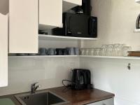 a kitchen with a sink and a microwave at Appartement Les Gets, 3 pièces, 4 personnes - FR-1-623-292 in Les Gets