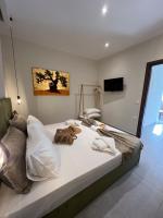 Posteľ alebo postele v izbe v ubytovaní Villa Maria apartments