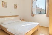 Postel nebo postele na pokoji v ubytování Rasin Apartments