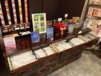 a display case in a store filled with lots of products at Kyoto Inn Gion The Second in Kyoto