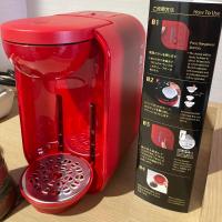 a red toaster on a table next to a box at Kyoto Inn Gion The Second in Kyoto