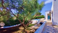 Vonkajšia záhrada v ubytovaní Pool Seaside Relais - VILLE Ninfea, Marea, Rosa e Cassiopea