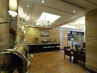 a dining room with a table and a bar at Boudl Kuwait Al Fahahil in Kuwait