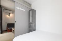 Postel nebo postele na pokoji v ubytování UHC Novelty Apartments