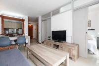 TV a/nebo společenská místnost v ubytování UHC Novelty Apartments