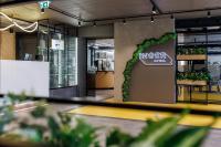a store with a green wreath on a wall at Inger Hotell in Narva
