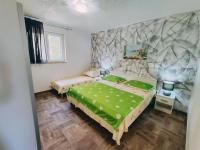 Posteľ alebo postele v izbe v ubytovaní APARTMANI NADA MUSTAPIC