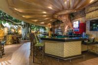 a bar in a restaurant with trees on the walls at Sheraton Niagara Falls in Niagara Falls