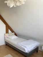 Posteľ alebo postele v izbe v ubytovaní La BERNIQUE Maison familiale Confort & Espace 3 chambres Jardin WIFI