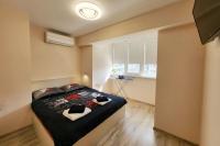 Postel nebo postele na pokoji v ubytování Bright City Apartment Varna