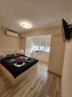 Postel nebo postele na pokoji v ubytování Bright City Apartment Varna