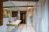 a bathroom with a sink and a shower at Palazzo Bembo - Exclusive Accommodation in Venice