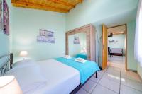 A bed or beds in a room at Georgios House