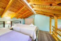 A bed or beds in a room at Georgios House