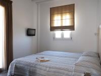 A bed or beds in a room at Studio Ornos