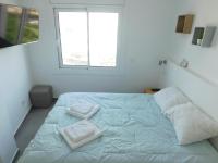 Posteľ alebo postele v izbe v ubytovaní GMID IMMO Apartamento Oasis