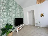 a living room with a flat screen tv on a wall at Casa in centro Ischia Porto Forever Four in Ischia