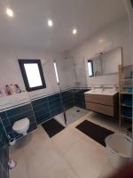 a bathroom with a shower and a sink and a toilet at maison neuve a 1 km de la plage in Saint-Germain-sur-Ay