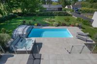 an overhead view of a swimming pool in a yard at Deconnexion et detente sur la Presqu ile de Rhuys in Le Tour-du-Parc