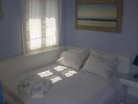 Łóżko lub łóżka w pokoju w obiekcie Blue Harmony Apartments