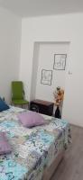 Posteľ alebo postele v izbe v ubytovaní Apartman Elza