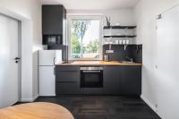 Kuchyň nebo kuchyňský kout v ubytování Boutique Hotel Mezi švy